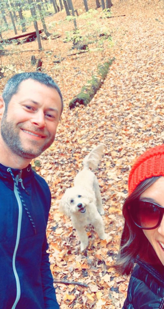 Dane and Caroline hiking with their dog