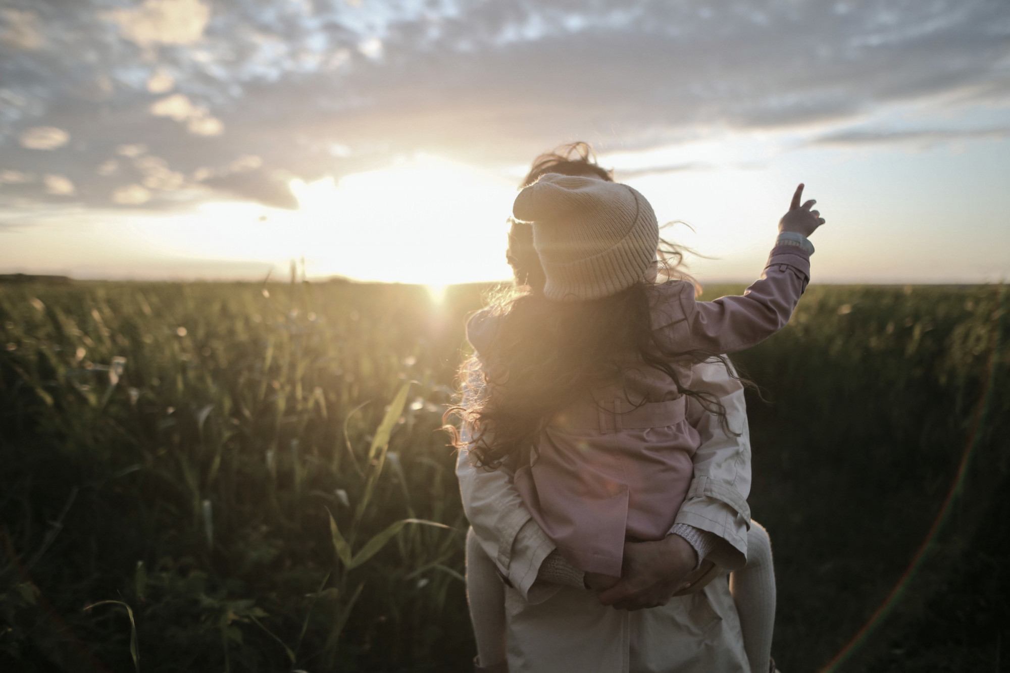 Birth and Adoptive parents with a baby