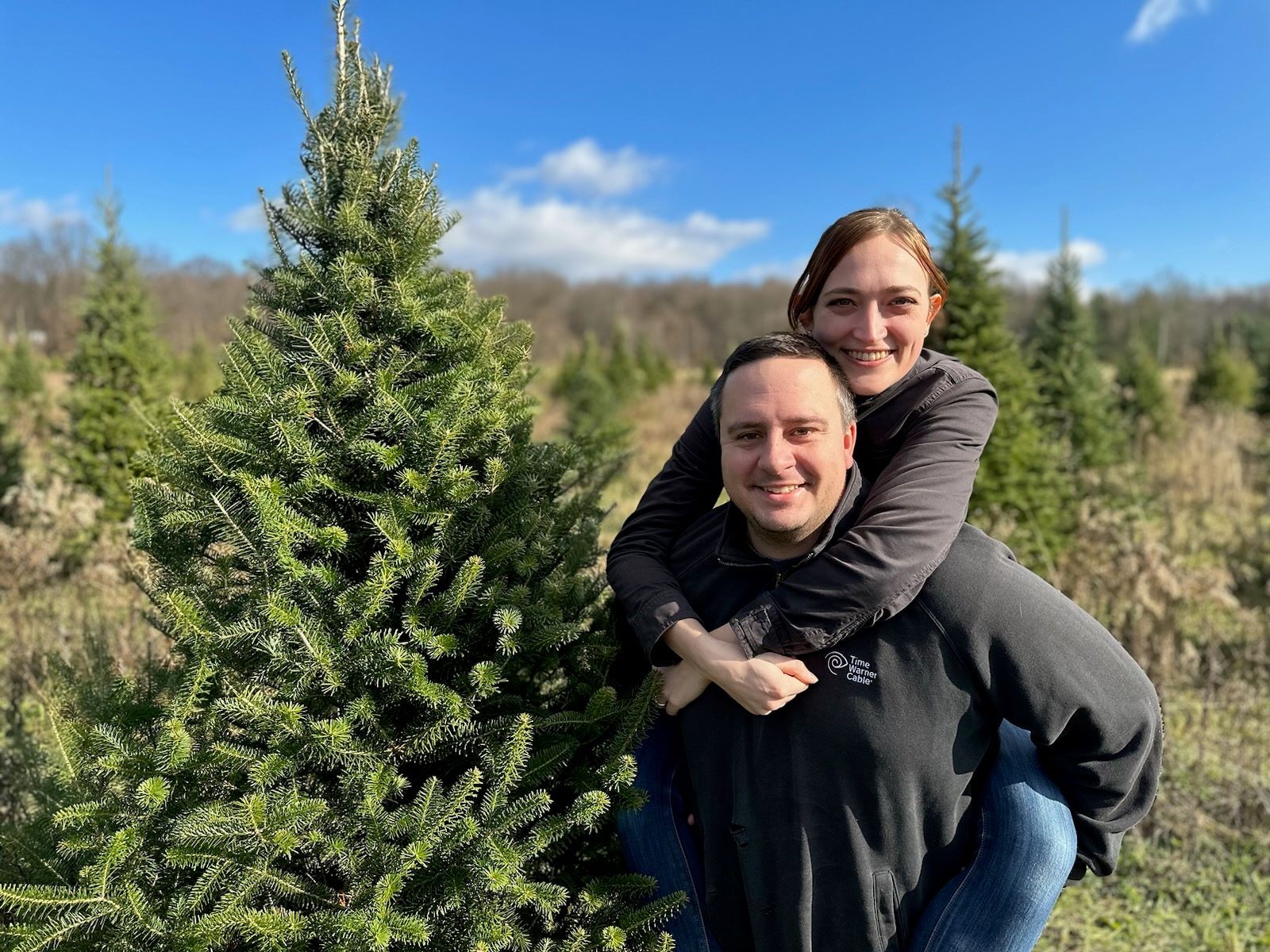 Nick and Abigail searching for the perfect Christmas tree